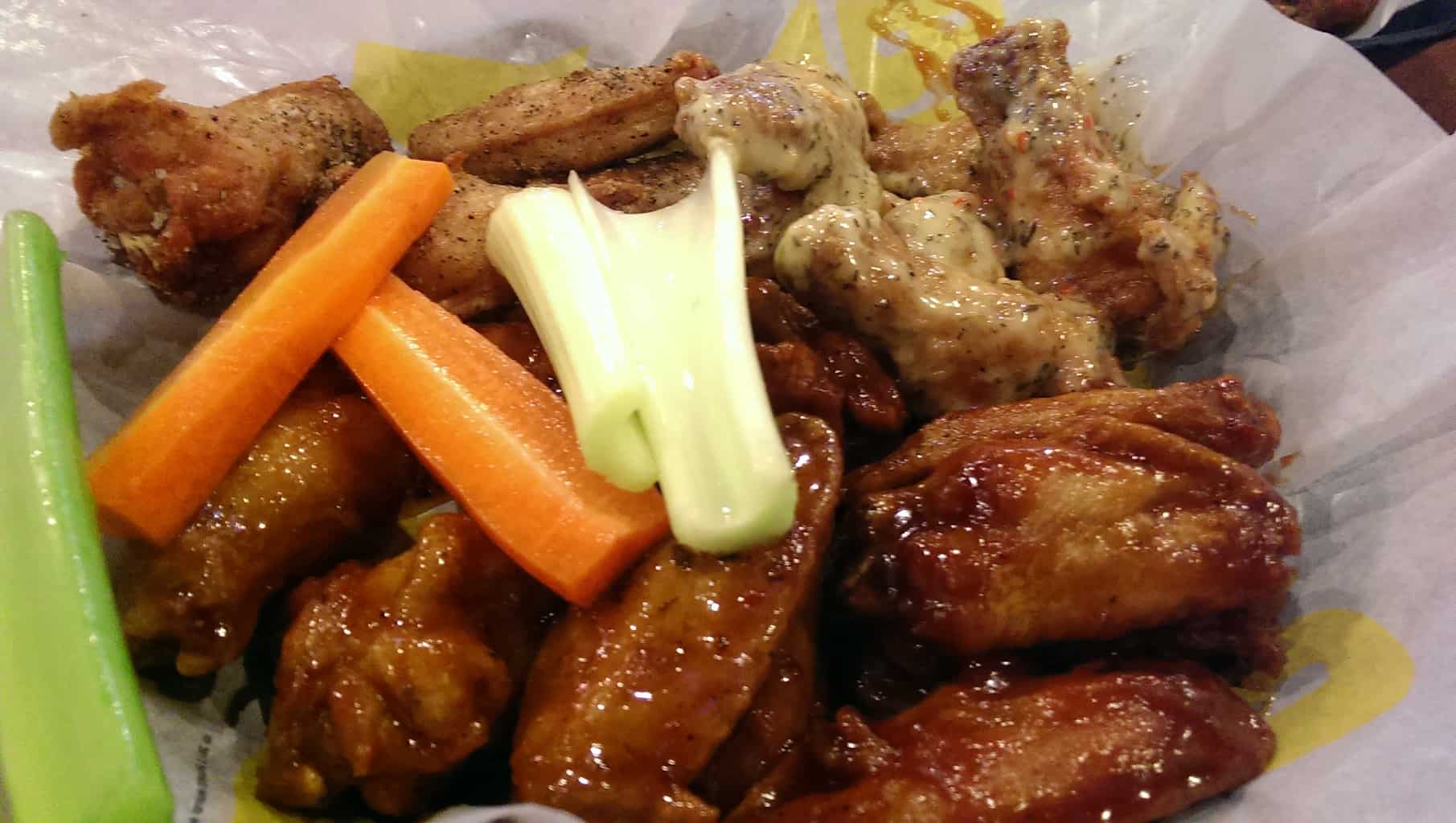 "Double" size traditional wings with salt and pepper, parmesan garlic, honey bbq, and jammin jalapeno sauces. (starting from top left corner, clockwise)
