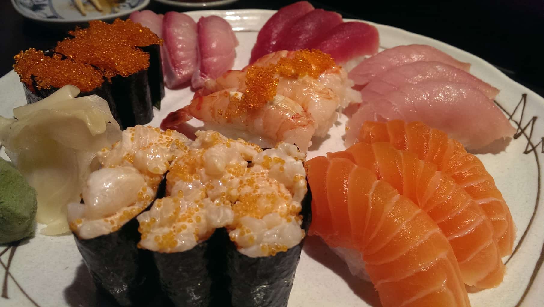 sushi combo cc (21 pieces of nigiri: 3 pieces each of tuna, red tuna, salmon, tobiko, ebi mayo, hamachi, chopped scallop)