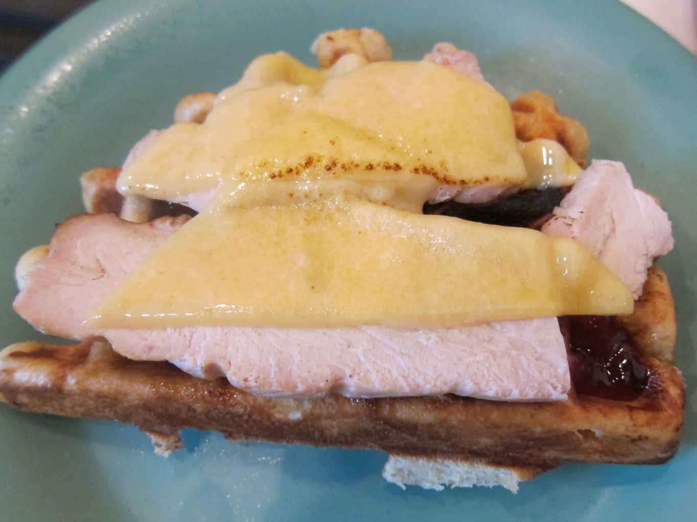 savory waffle with roast turkey breast, havari cheese & raspberry jam