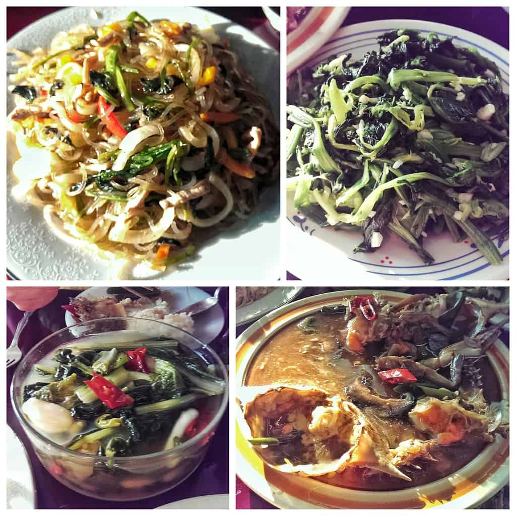 From top left clockwise: japchae, spinach salad, ganjang gejang, and mul-kimchi